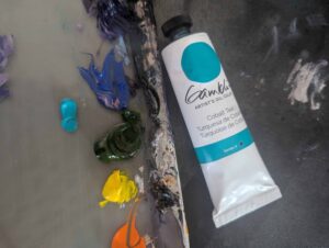 Detail shot of paint palette with Cyan tube